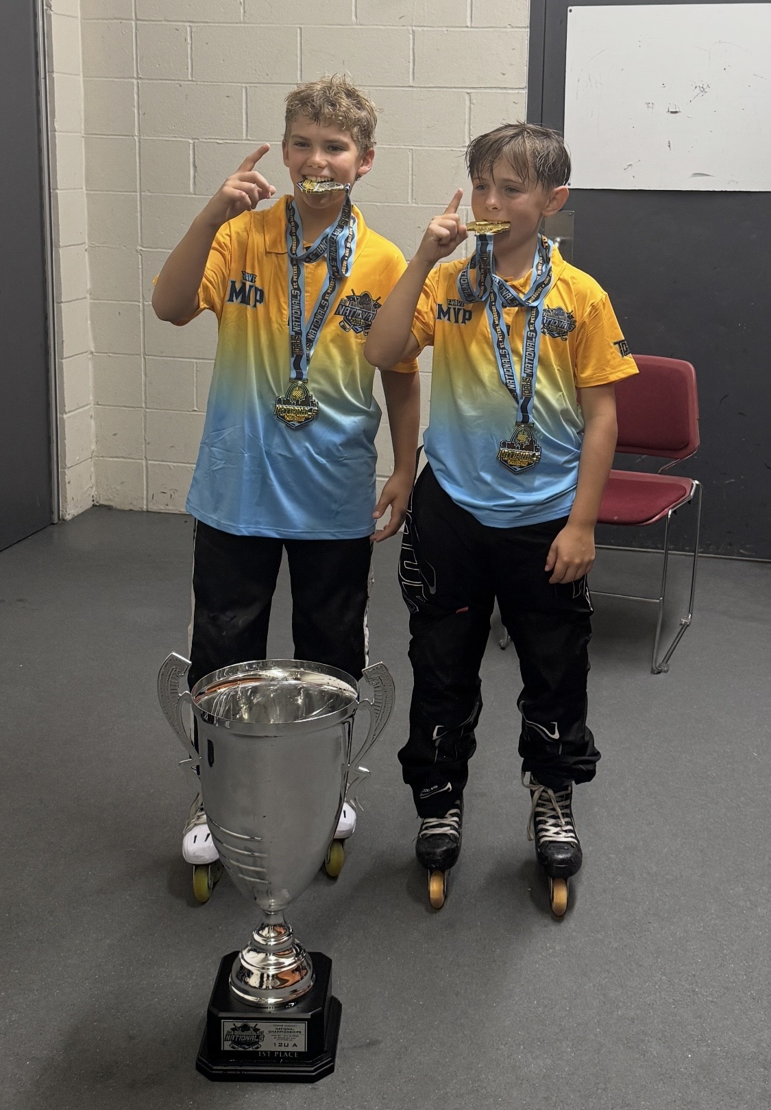 Champions with gold medals and the TORHS Cup